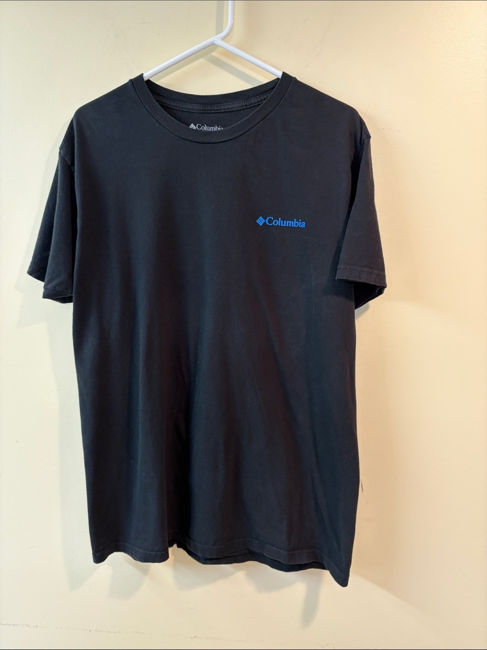 Columbia Black Tee with Blue Logo Chest Emblem and Las Vegas sky line in back